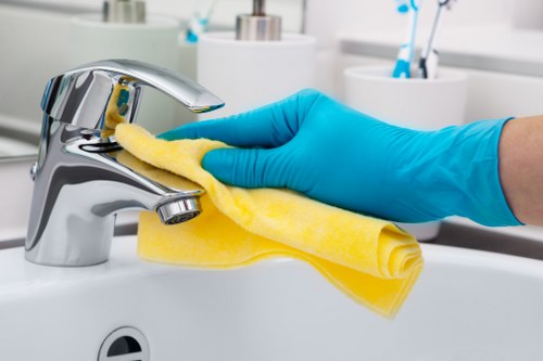 Local cleaner preparing a short-let property for the next guest in E3